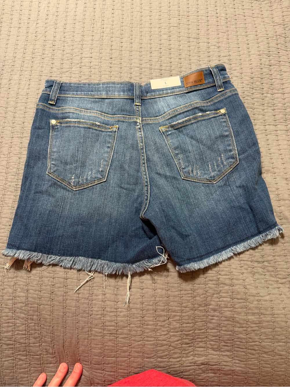 Judy Blue Distressed X’s and O’s Mid Rise Denim Shorts - Picture 3 of 3